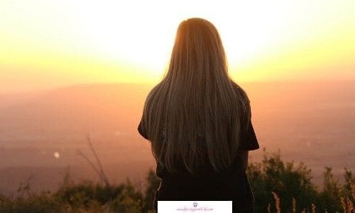 Difficulties in life cause you to isolate yourself like this woman sitting alone and watching the sunrise