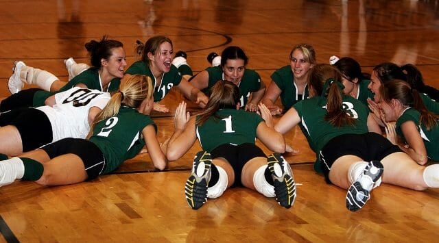 Team unity and cooperation during a volleyball time out